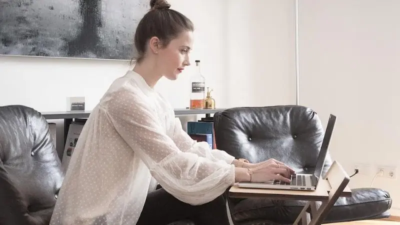 Lady typing on laptop