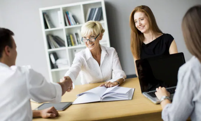 Customer shaking hands with provider