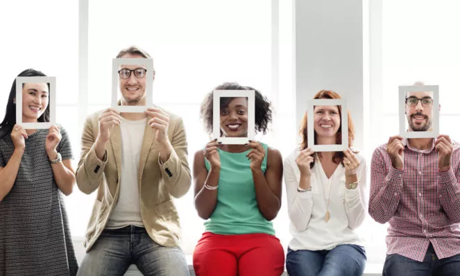 5 people holding up frames to their faces